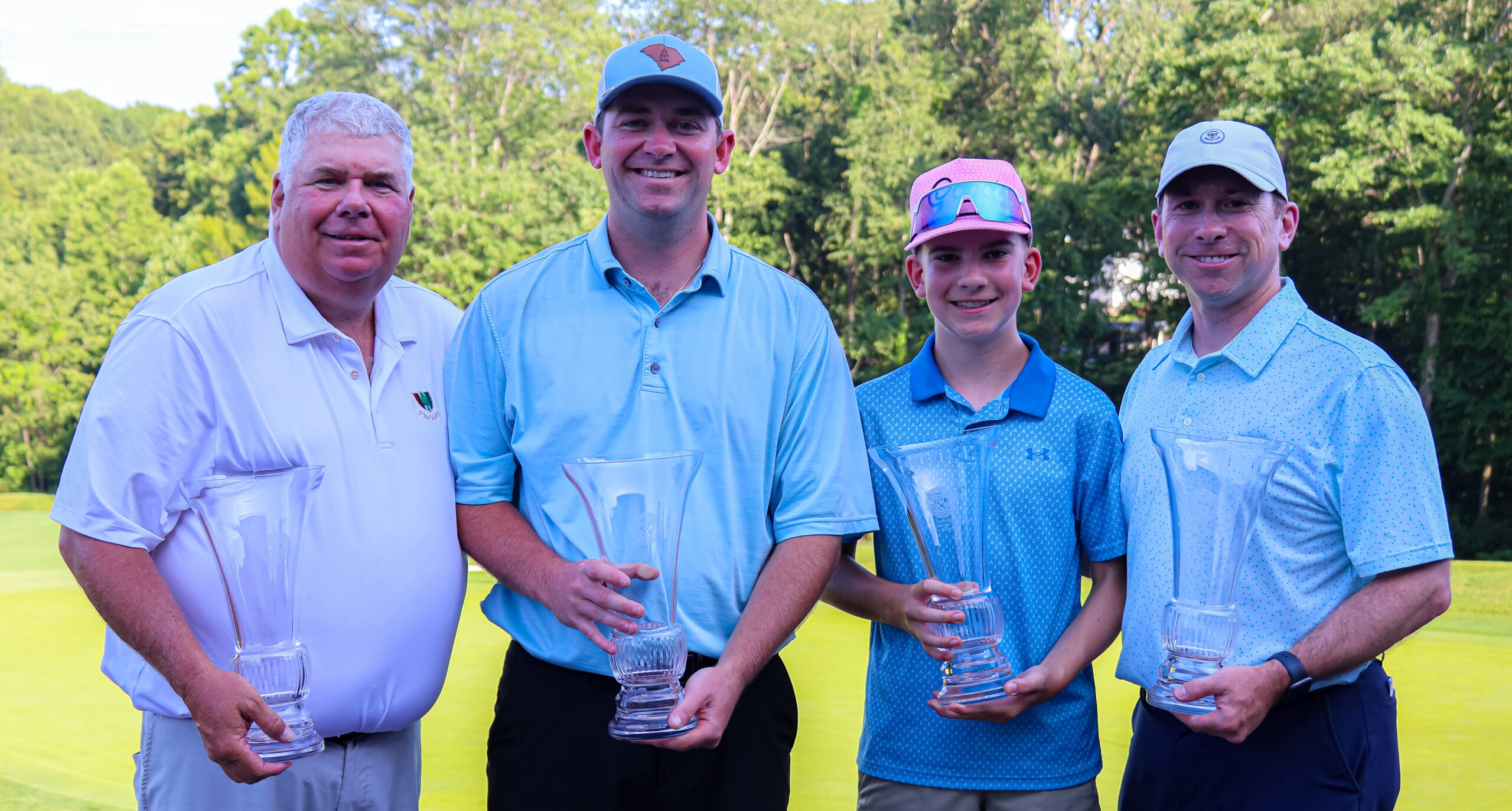 Father & Son Champions, Arnold & Arnie Cutrell (left), and Parent & Child Champions, Patrick & Chhirs Shipley (right)